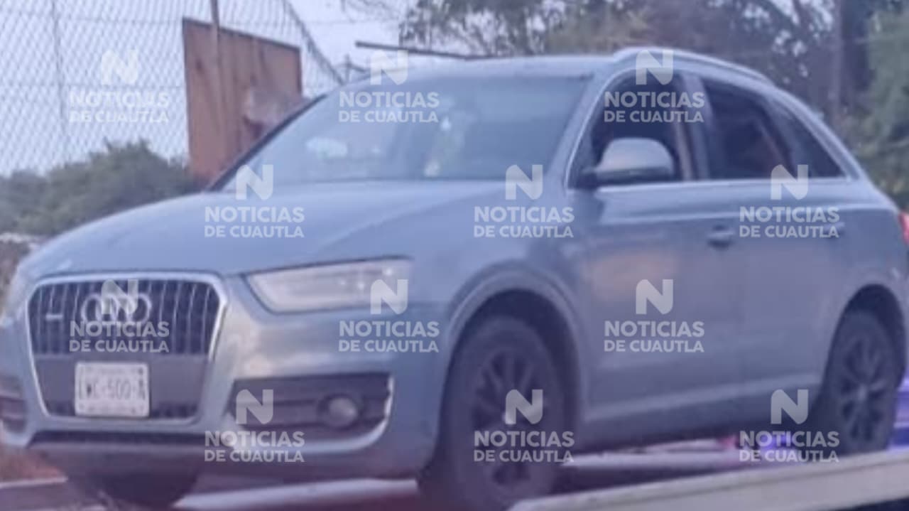Hallan a mujer sin vida junto a un vehículo de lujo en Tlayecac en Ayala